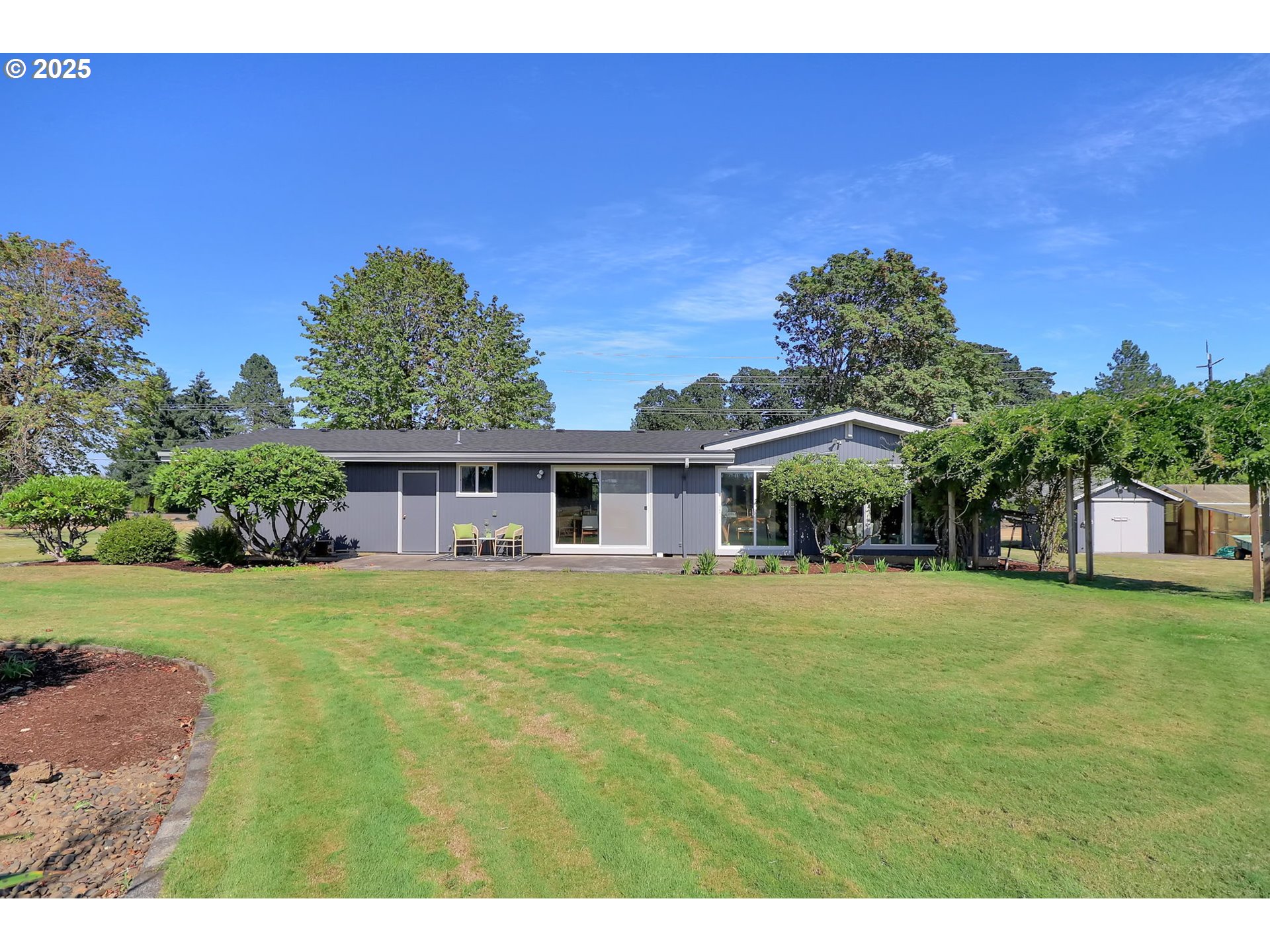 90774 Alvadore Road Junction City, OR 97448 - Photo 32 of 43 a front view of a house with a garden