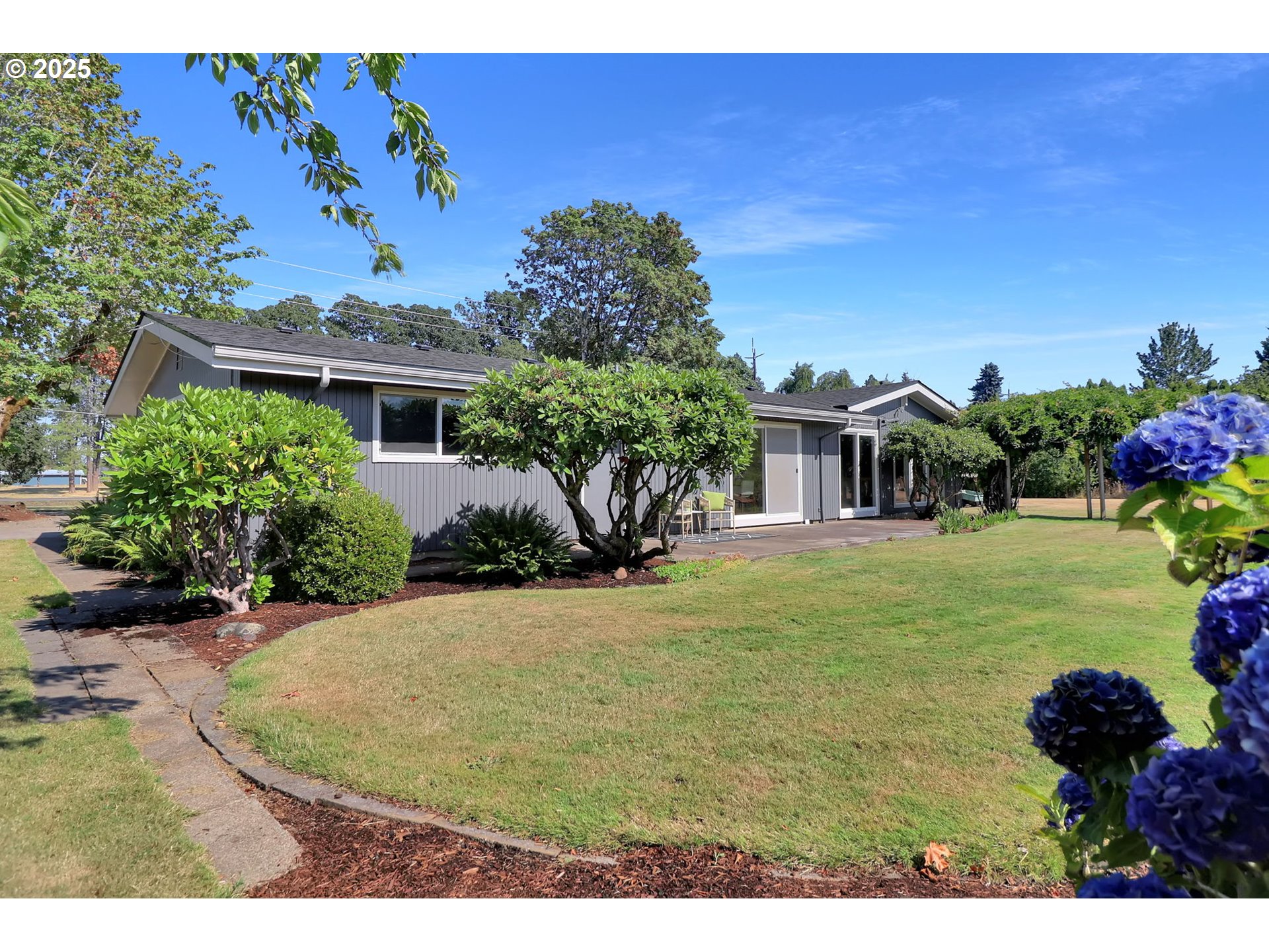 90774 Alvadore Road Junction City, OR 97448 - Photo 33 of 43 a view of a house with a backyard