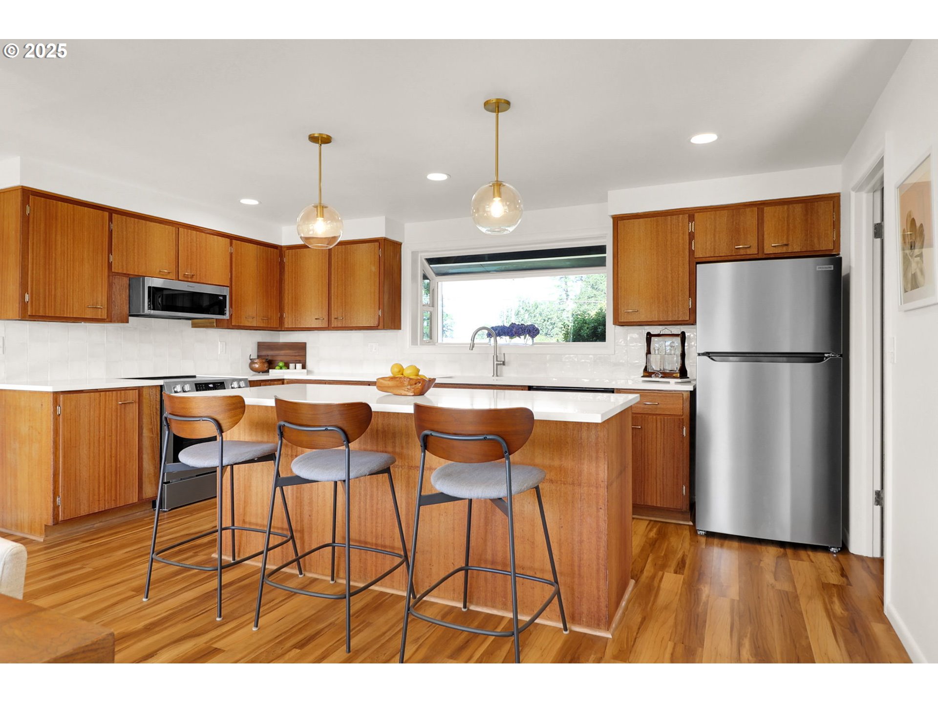 90774 Alvadore Road Junction City, OR 97448 - Photo 10 of 43 a kitchen with stainless steel appliances granite countertop a refrigerator a sink dishwasher a stove with wooden cabinets and floor