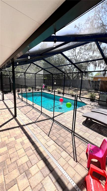 11102 Upton Street Spring Hill, FL 34608 - Photo 16 of 23 a roof deck with table and chairs