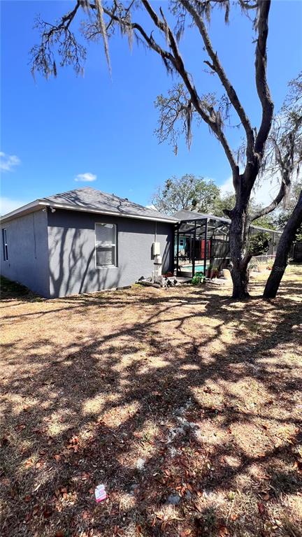 11102 Upton Street Spring Hill, FL 34608 - Photo 21 of 23 a swimming pool with outdoor seating and yard