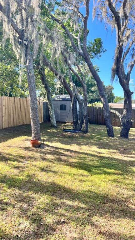 11102 Upton Street Spring Hill, FL 34608 - Photo 23 of 23 a view of a swimming pool with a patio