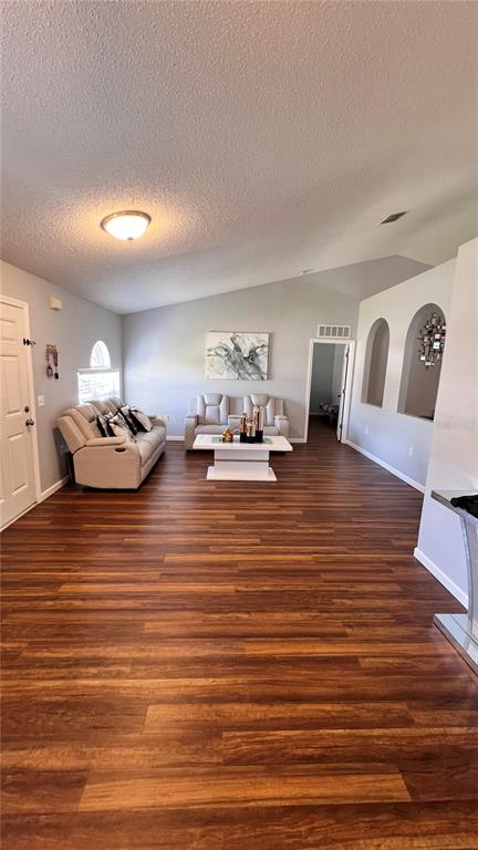 11102 Upton Street Spring Hill, FL 34608 - Photo 3 of 23 a room with furniture and wooden floor