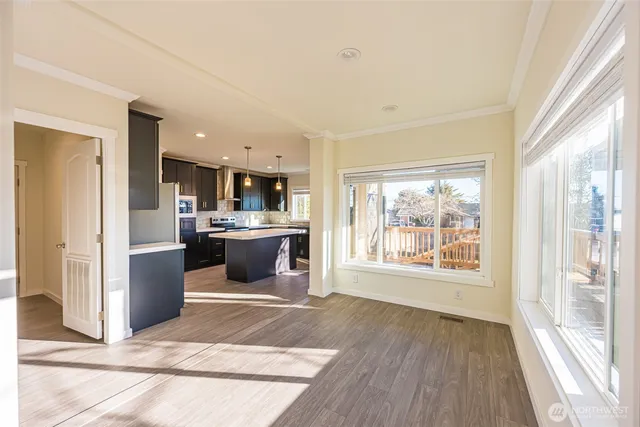 a kitchen with a refrigerator and a sink