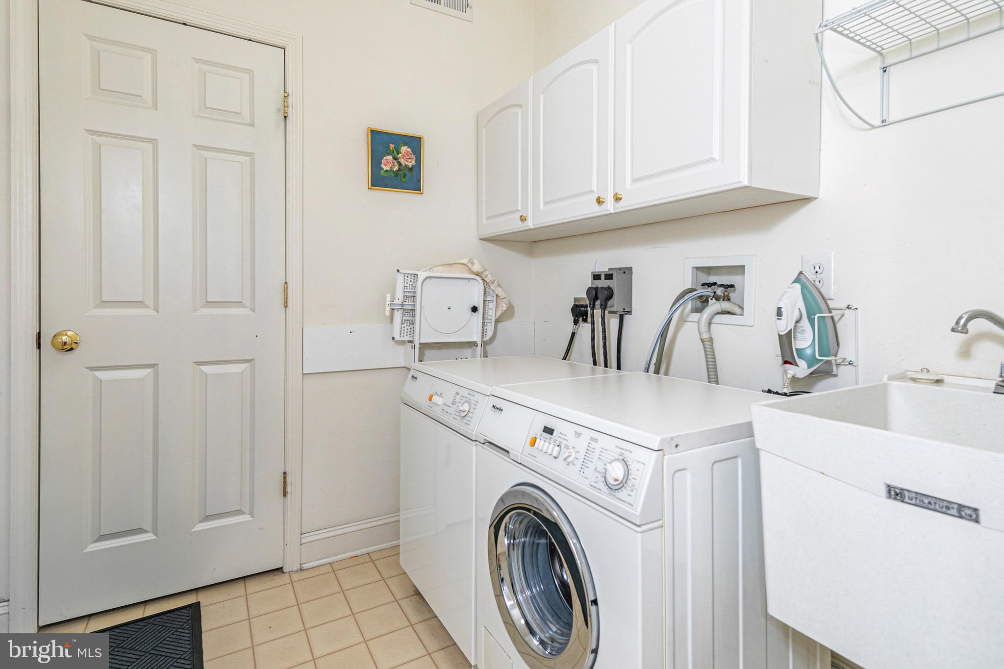 1 Bethpage Drive Skillman, NJ 08558 - Photo 21 of 32 First Floor Laundry Room, tub & door to Garage