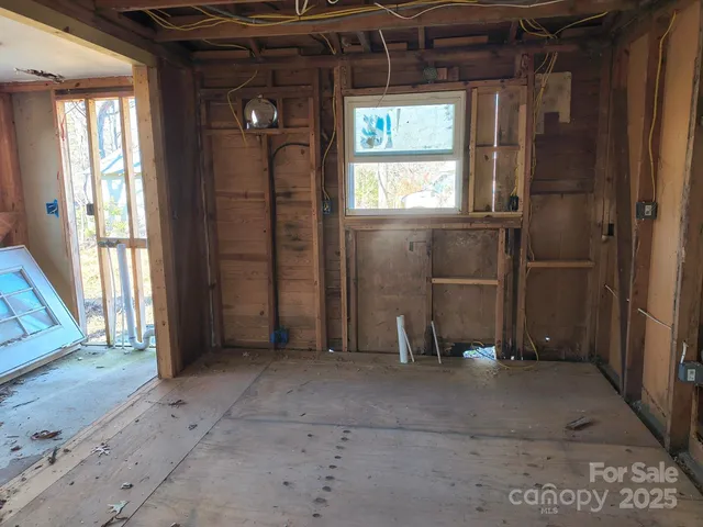 a view of a room with sliding door and wooden floor