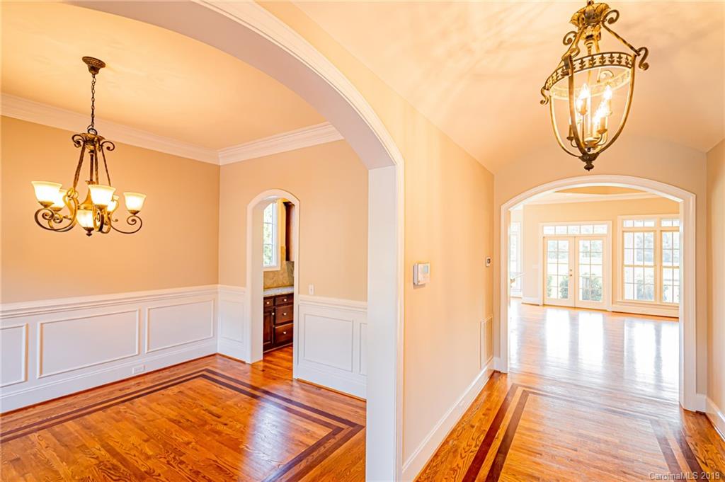 6631 Fox Ridge Circle Davidson, NC 28036 - Photo 3 of 48 a view of empty room with wooden floor and fan