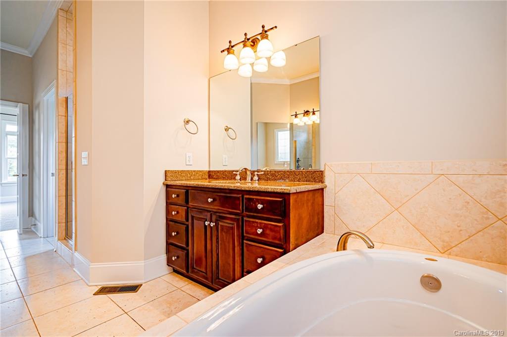 6631 Fox Ridge Circle Davidson, NC 28036 - Photo 40 of 48 a bedroom with a bed and a dresser