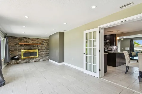 a view of an empty room with a fireplace