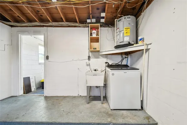 a view of storage and utility room with washer and dryer