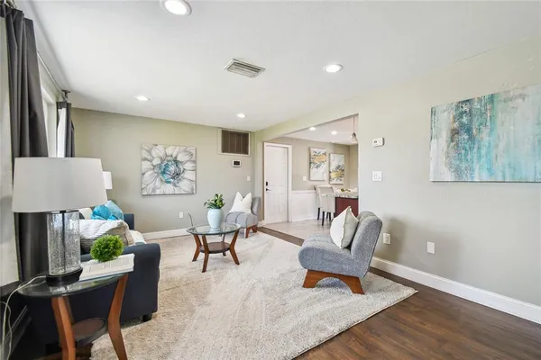 a living room with furniture and a table