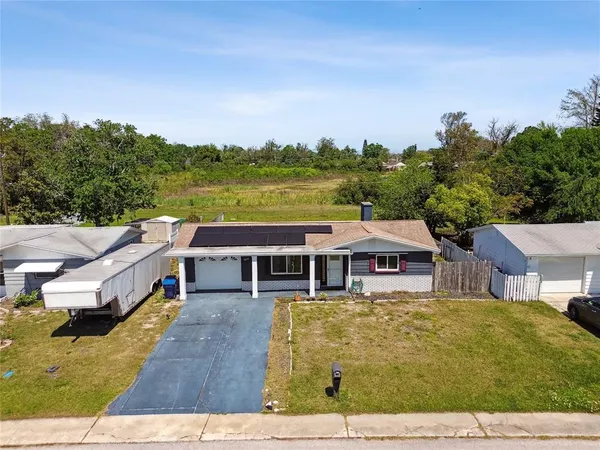 a view of a house with a big yard