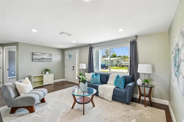 a living room with furniture and a large window