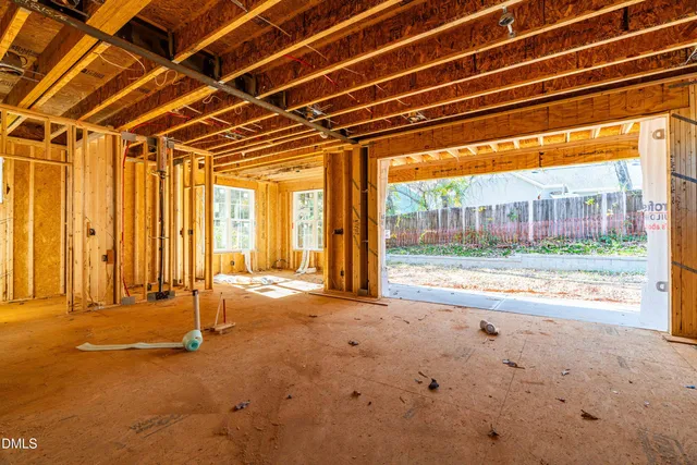 a view of a room with wooden walls and floor