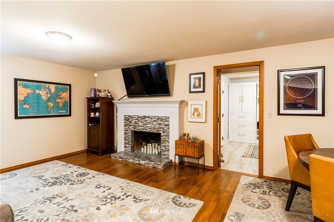 15543 Southeast 169th Street Renton, WA 98058 - Photo 12 of 35 a living room with furniture and a fireplace