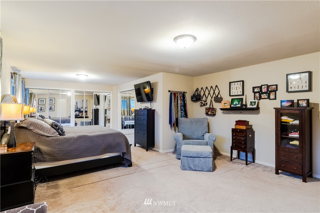 15543 Southeast 169th Street Renton, WA 98058 - Photo 16 of 35 a bedroom with bed and furniture