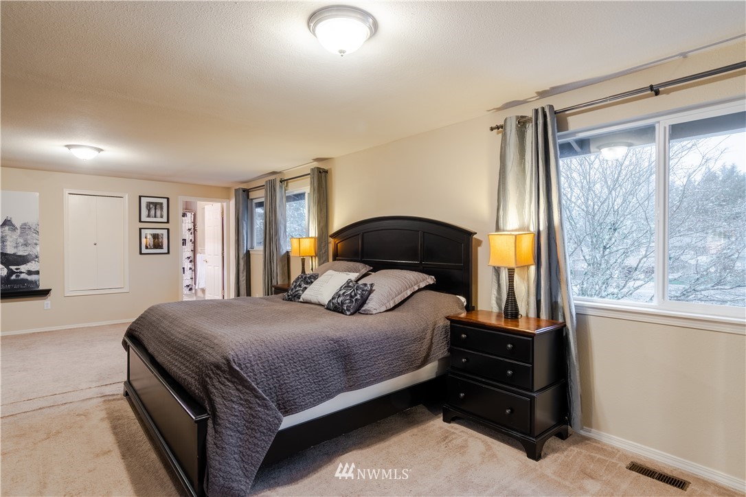 15543 Southeast 169th Street Renton, WA 98058 - Photo 18 of 35 a bedroom with a bed and a window