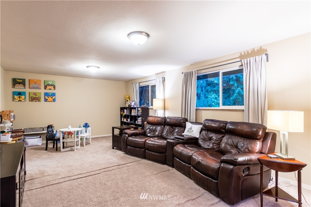 15543 Southeast 169th Street Renton, WA 98058 - Photo 24 of 35 a living room with furniture and a window