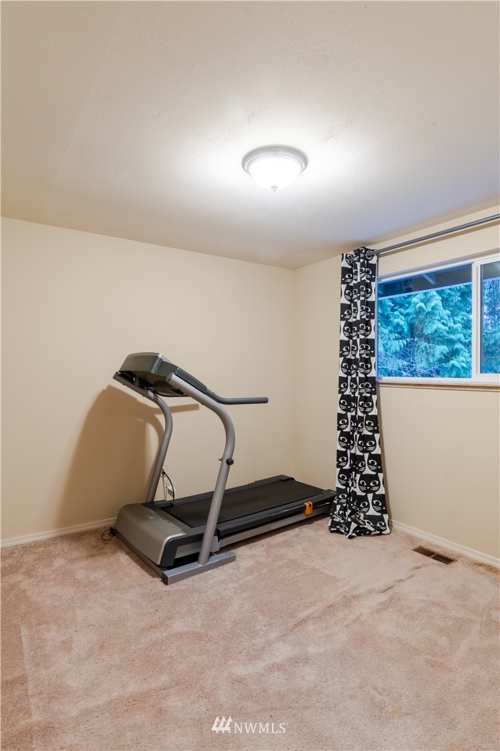 15543 Southeast 169th Street Renton, WA 98058 - Photo 28 of 35 a room with gym equipment