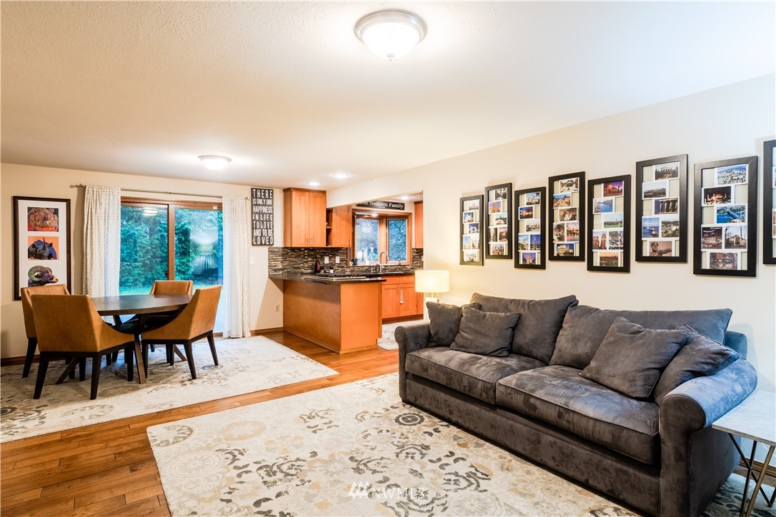15543 Southeast 169th Street Renton, WA 98058 - Photo 10 of 35 a living room with furniture wooden floor and a dining table