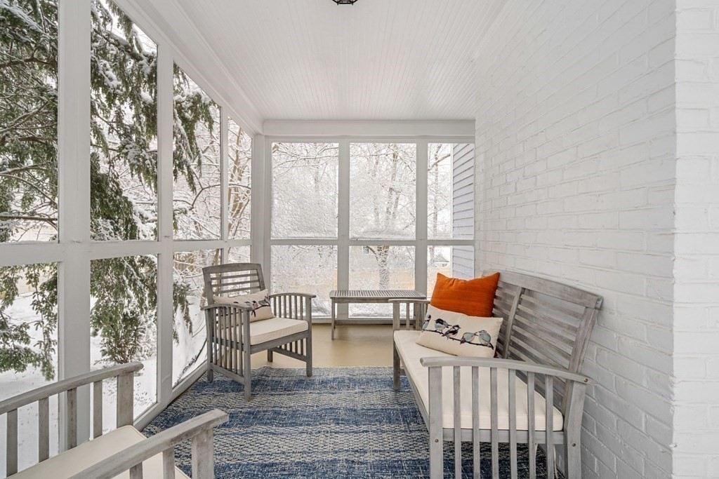 11 Oakencroft Road Wellesley, MA 02482 - Photo 23 of 28 a living room with furniture and a floor to ceiling window