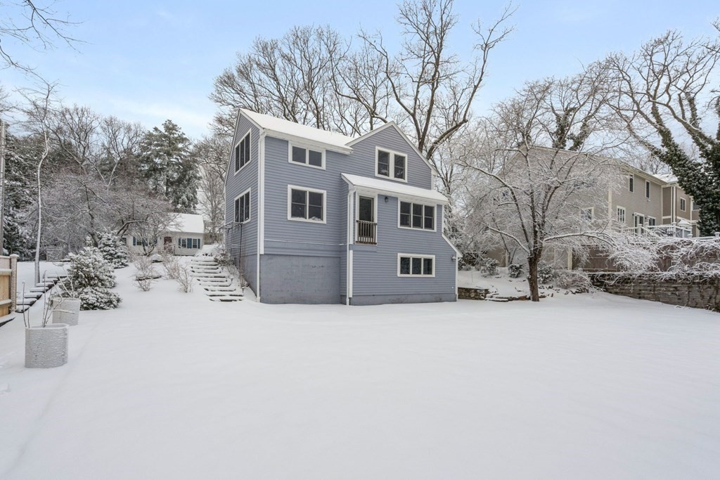 11 Oakencroft Road Wellesley, MA 02482 - Photo 25 of 28 a view of a house with a yard covered in snow