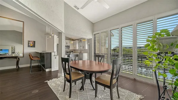 a dining room with furniture and window