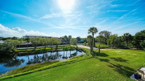 a view of a lake with a yard