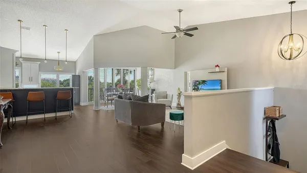 a dining room with furniture and wooden floor