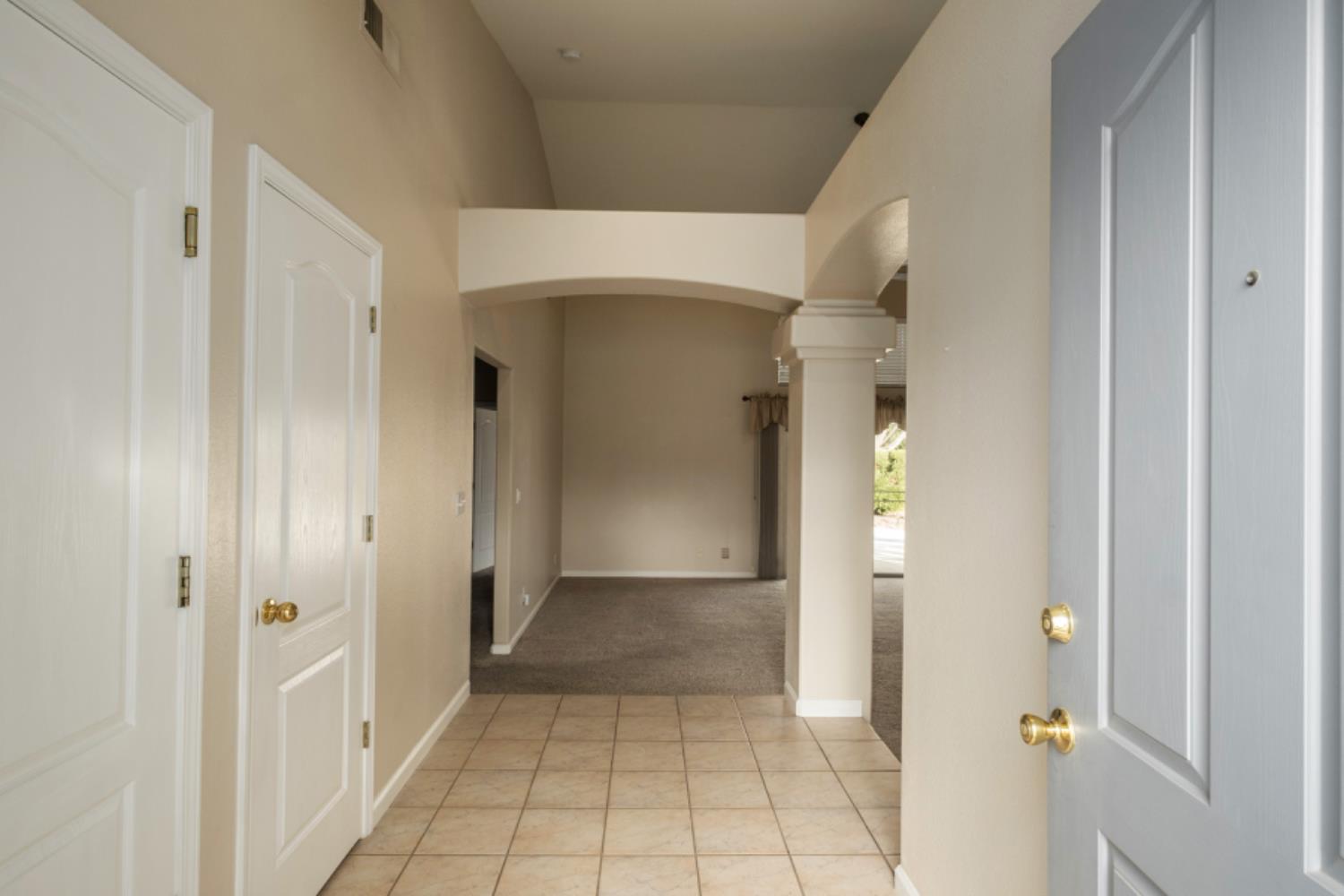 793 Applegate Avenue Clovis, CA 93611 - Photo 4 of 20 a view of a hallway with wooden shelves