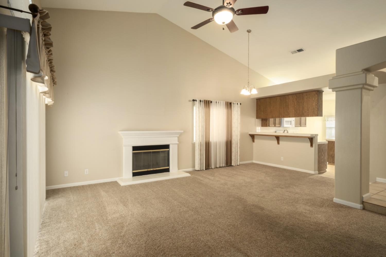 793 Applegate Avenue Clovis, CA 93611 - Photo 7 of 20 a view of a kitchen with a sink and a fireplace