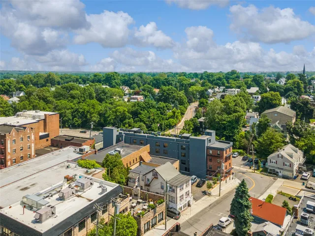 an aerial view of a house with backyard