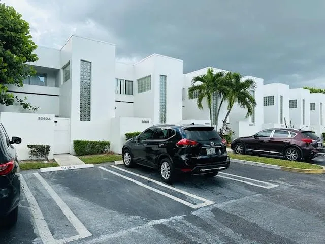 a car parked in front of a house
