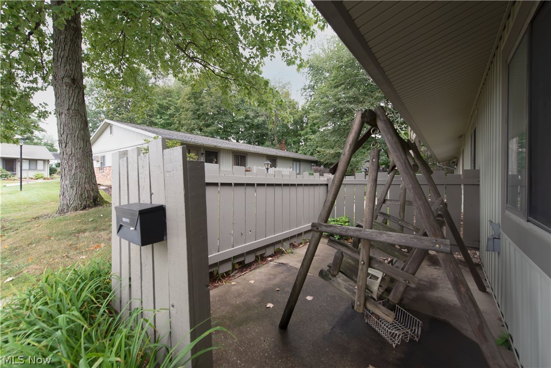 2749 Mull Avenue Akron, OH 44321 - Photo 3 of 14 Enjoy a relaxing swing on your fenced-in patio.