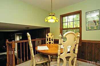 4409 Old Colony Road Raleigh, NC 27613 - Photo 6 of 10 a view of a dining room with furniture window and wooden floor