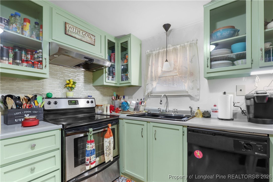 156 Connell Road Carthage, NC 28327 - Photo 8 of 43 a kitchen with stainless steel appliances a stove a sink and cabinets