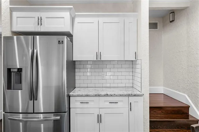 a bathroom with a sink a mirror and a shower