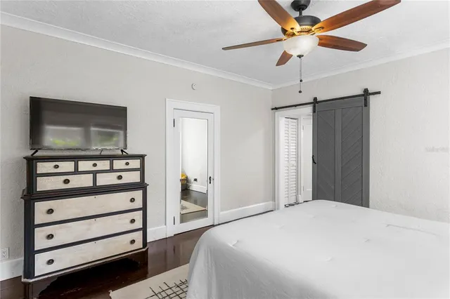 a view of a patio with table and chairs and wooden fence