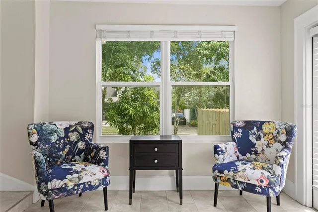 a view of an empty room and a window