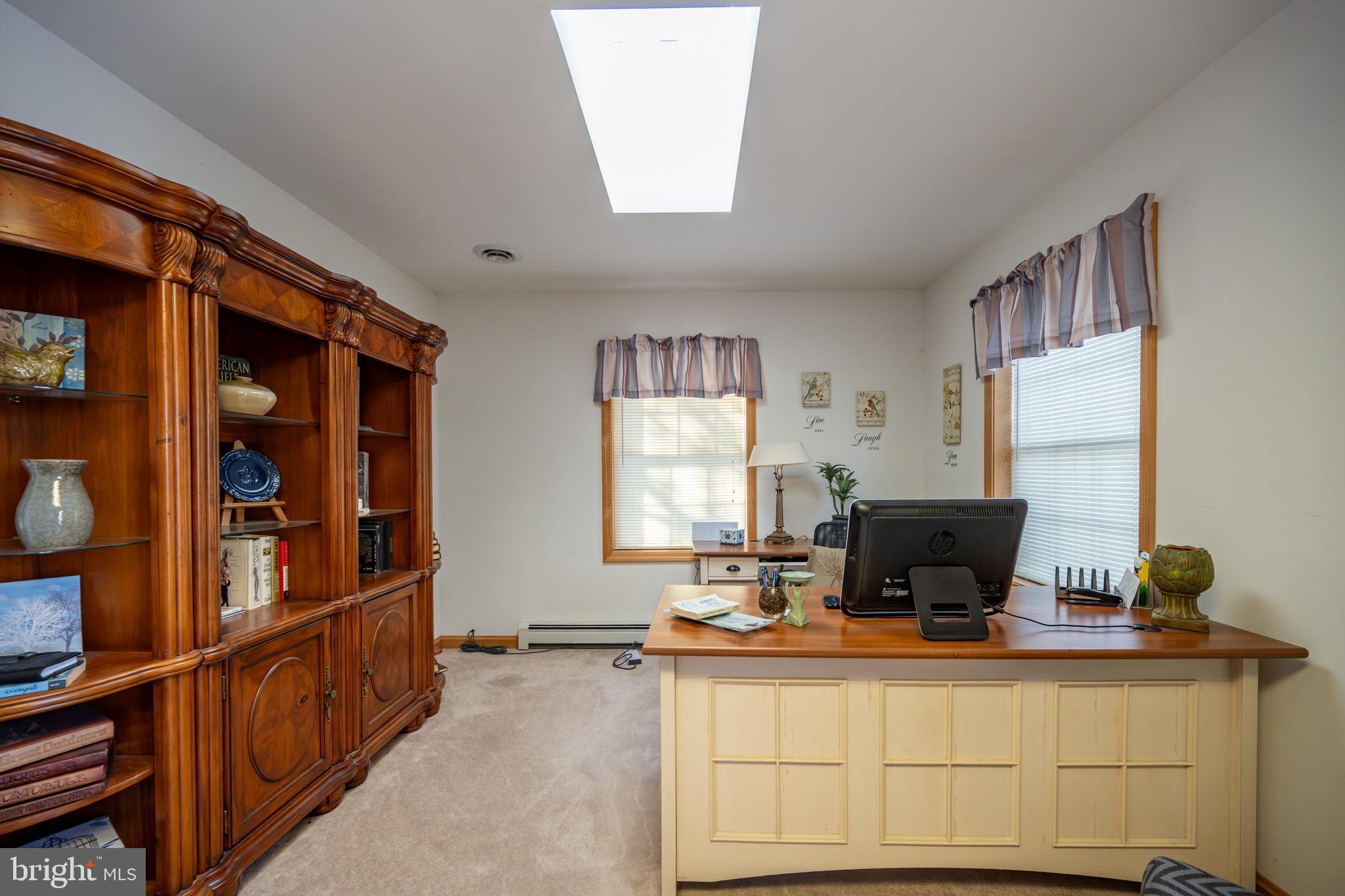 3836 Chestnut Grove Road Swanton, MD 21561 - Photo 76 of 111 a living room with furniture a window and flat screen tv