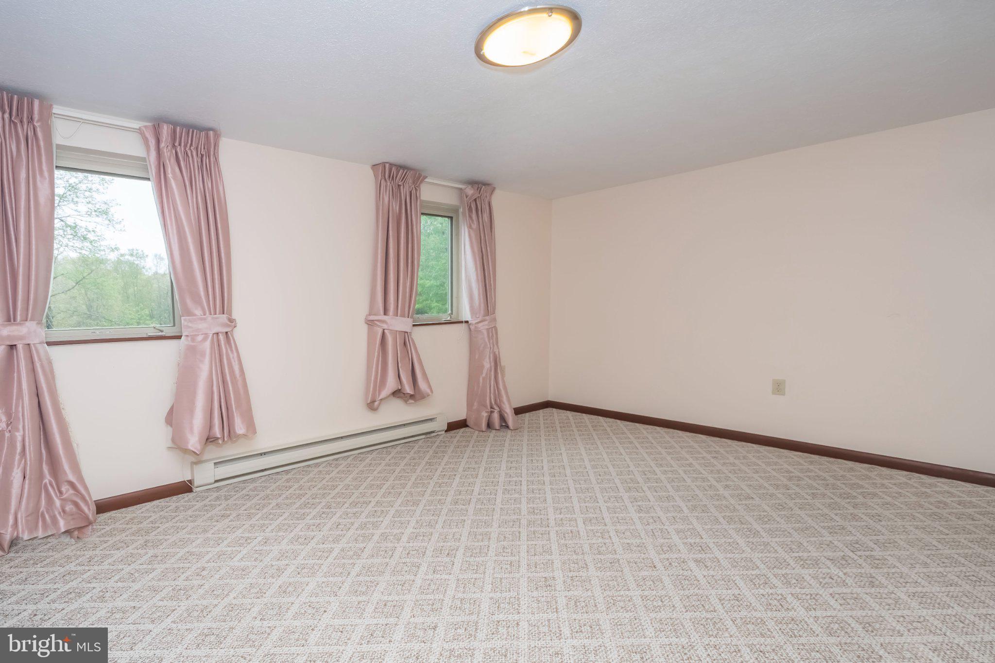 206 Mayhew Inn Road Oakland, MD 21550 - Photo 14 of 31 an empty room with windows