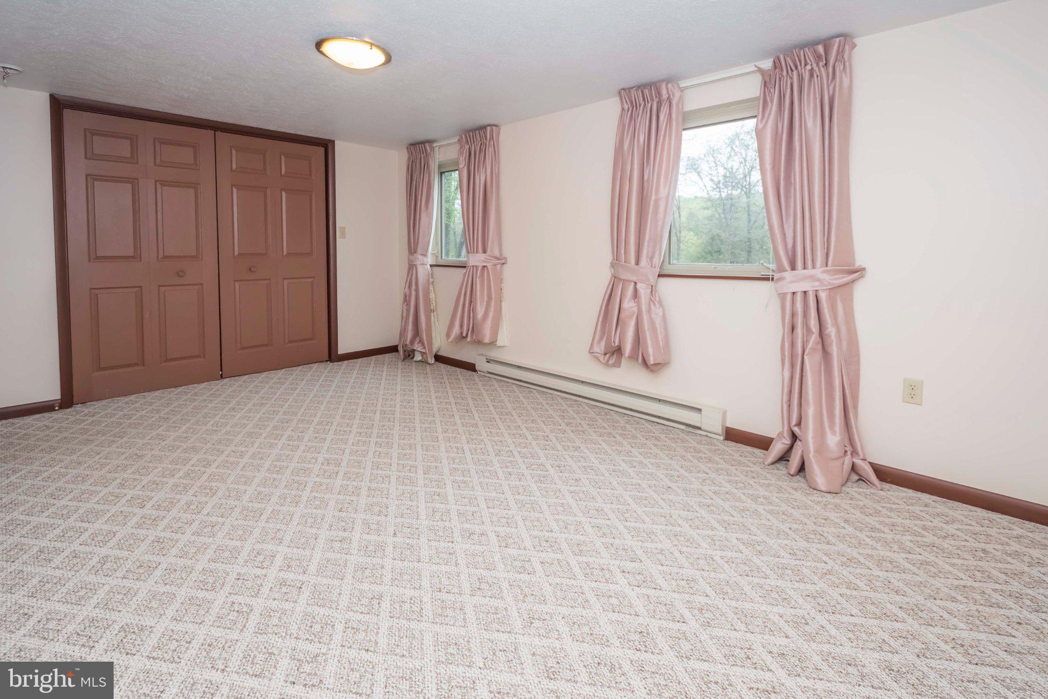 206 Mayhew Inn Road Oakland, MD 21550 - Photo 17 of 31 an empty room with windows