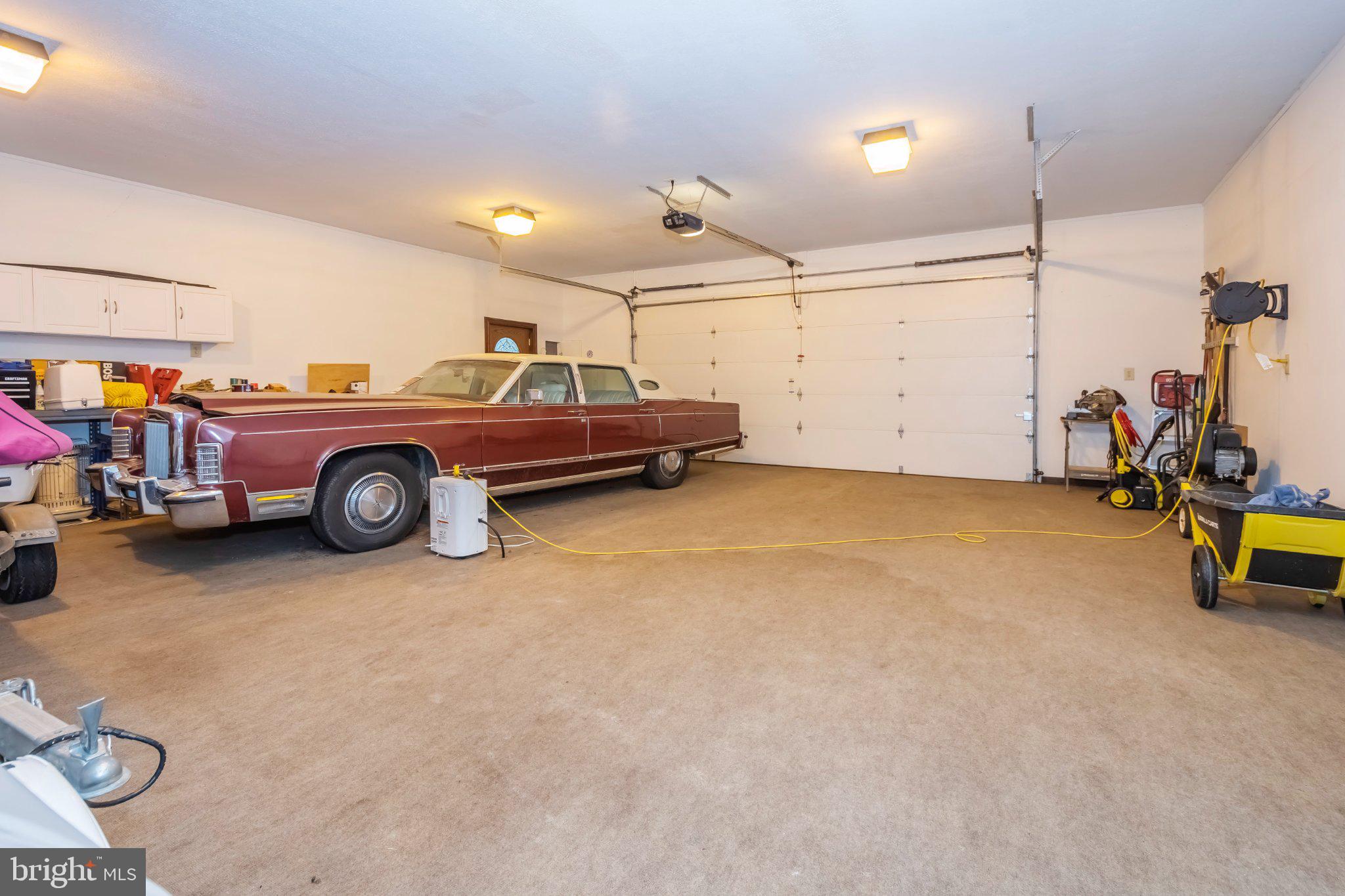 206 Mayhew Inn Road Oakland, MD 21550 - Photo 23 of 31 a car is parked in a garage