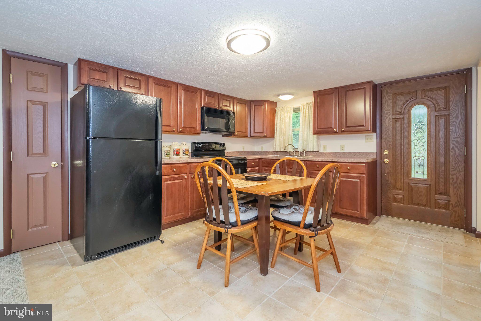 206 Mayhew Inn Road Oakland, MD 21550 - Photo 7 of 31 a view of a dining room with furniture