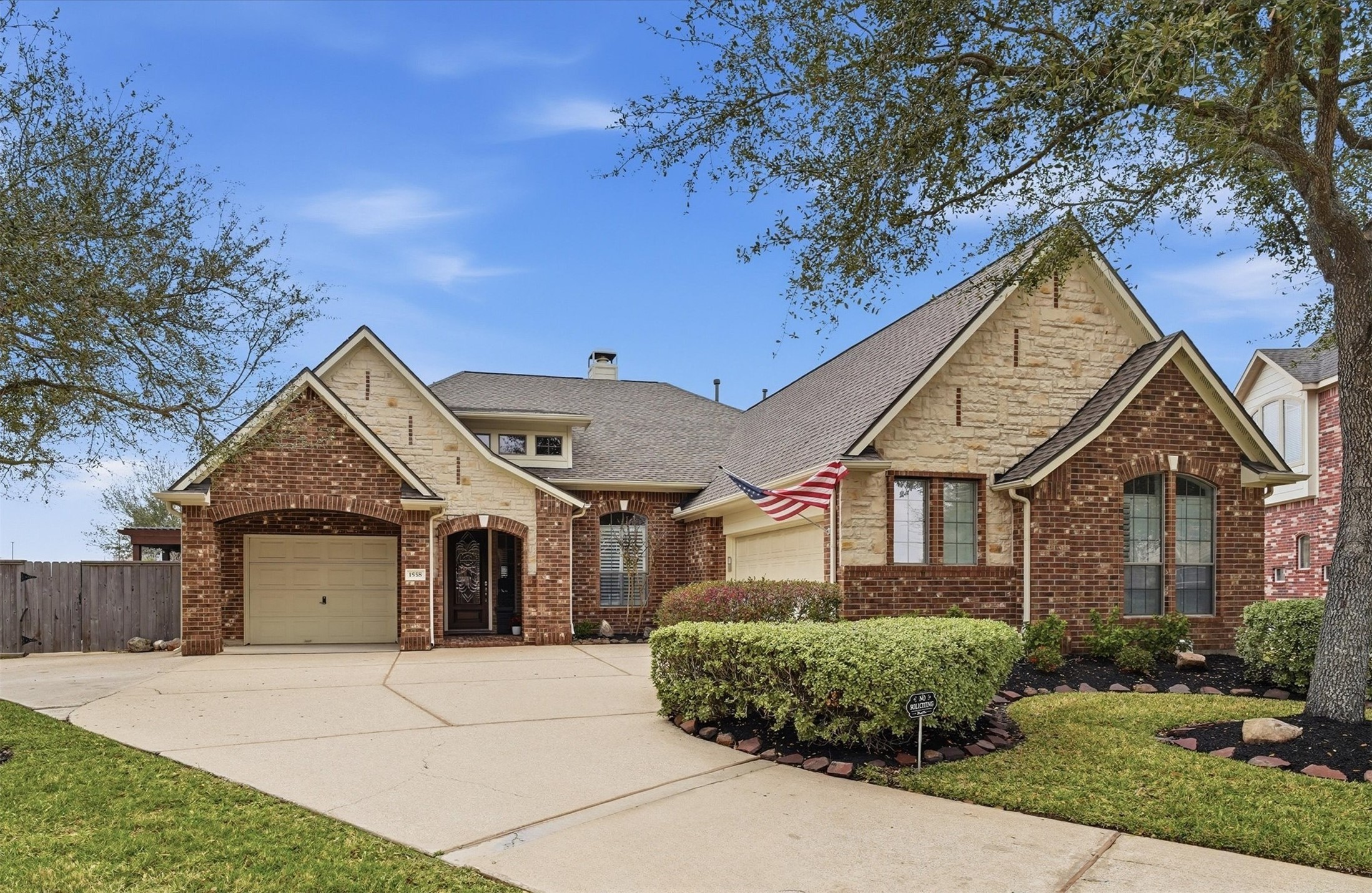 Beautiful brick and stone elevation located on a quiet cul-de-sac in Victory Lakes with manicured landscaping and oversized driveway.