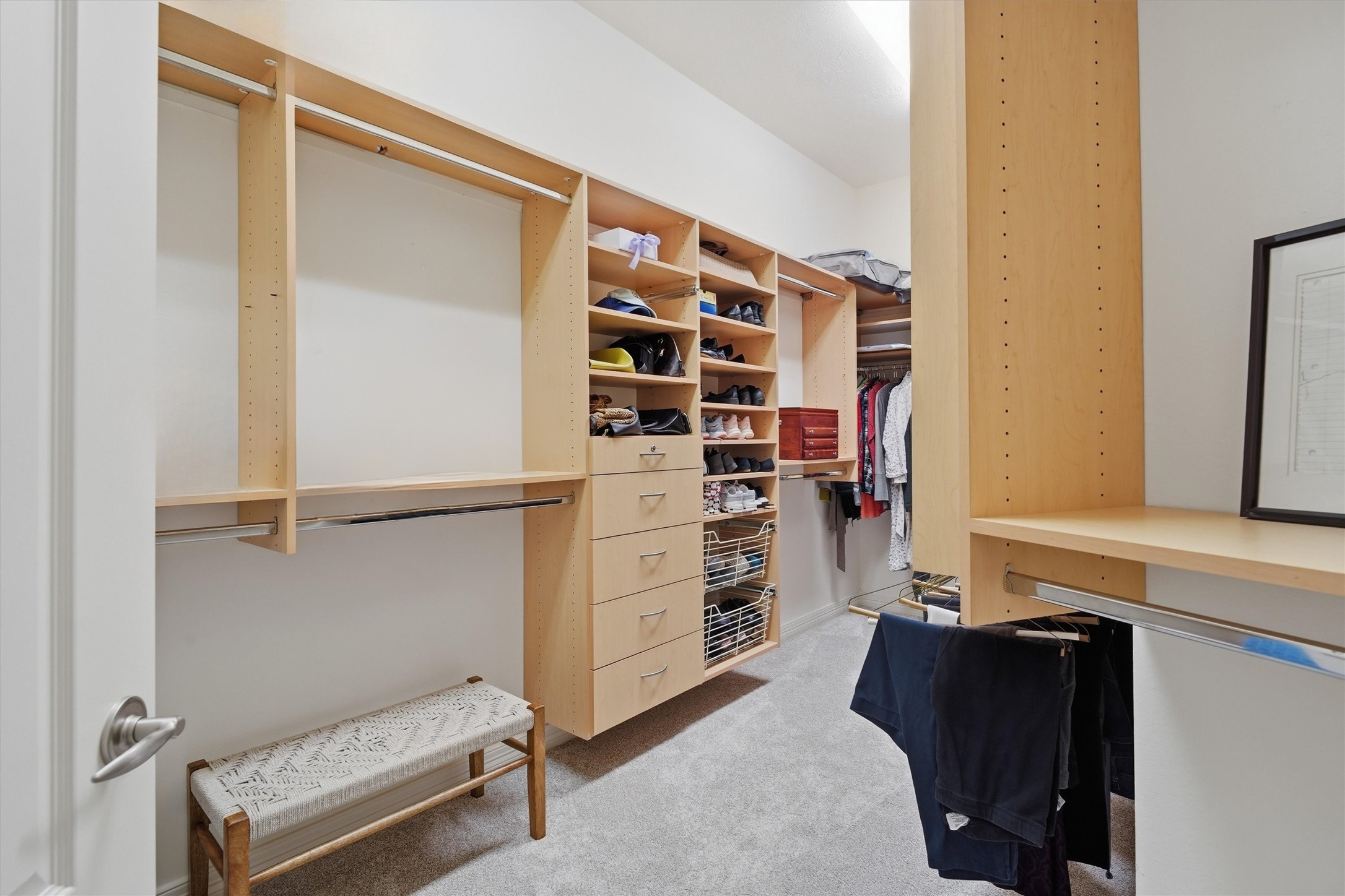 1558 Viejo Road League City, TX 77573 - Photo 15 of 28 His and Hers custom walk-in closets with built-in shelving, drawers, and abundant hanging space.