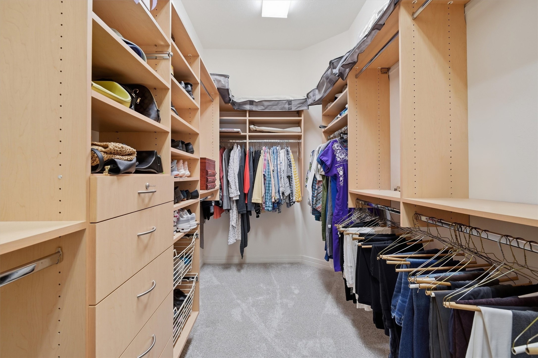 1558 Viejo Road League City, TX 77573 - Photo 16 of 28 Custom closet system with dedicated shoe storage, adjustable shelving, and organized layout.