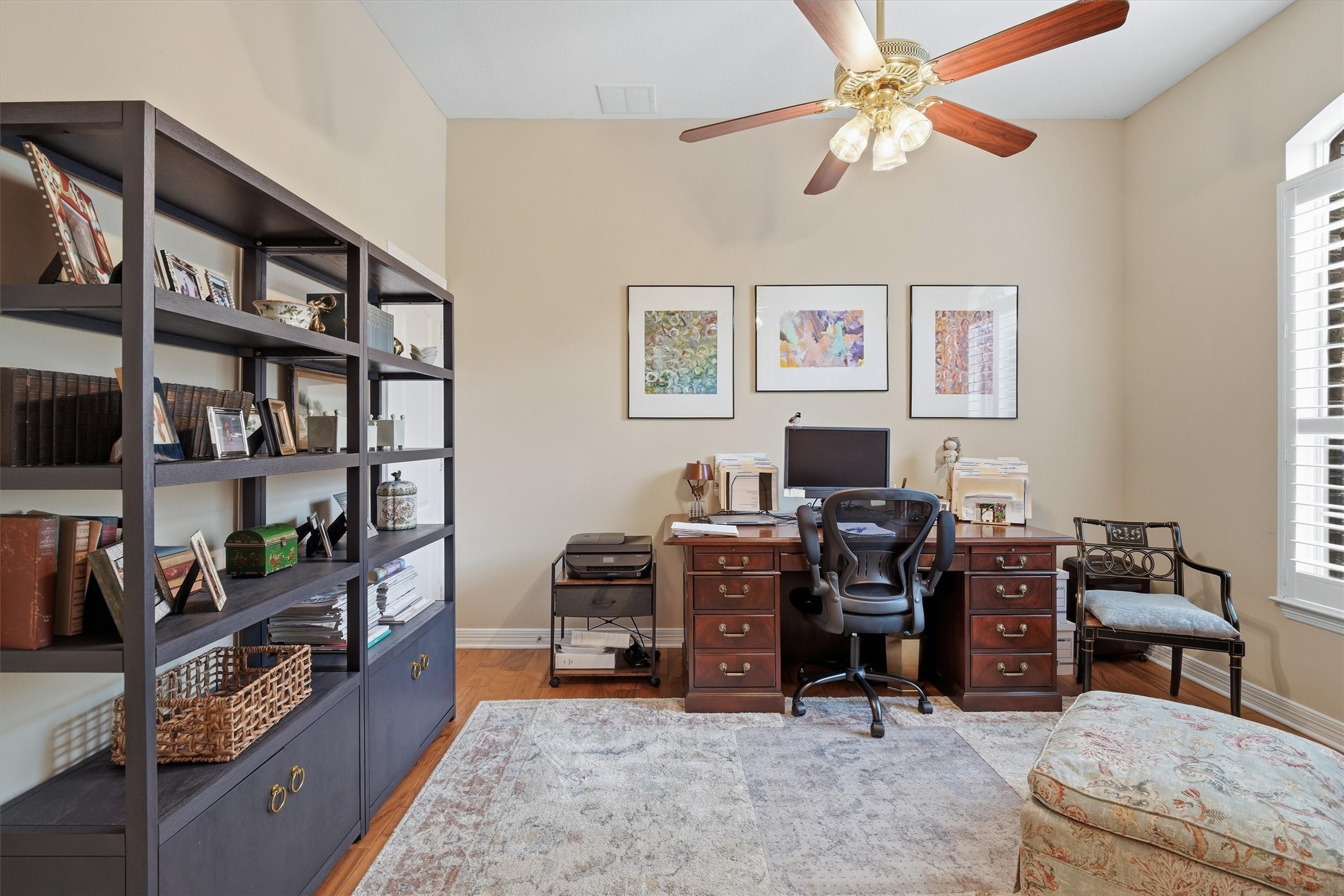 1558 Viejo Road League City, TX 77573 - Photo 21 of 28 Home office or 4th bedroom with wood flooring, ceiling fan, and large window providing natural light.