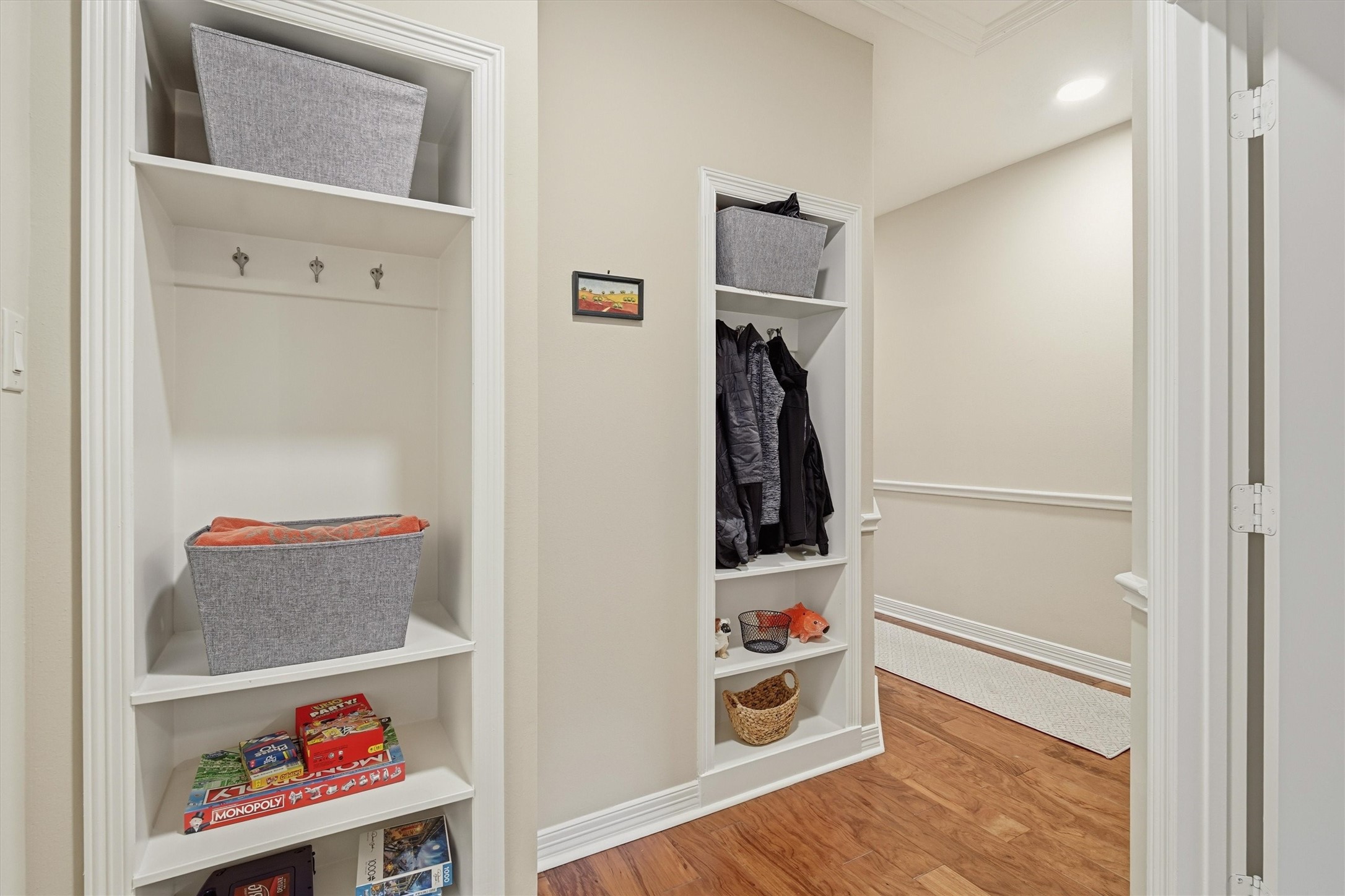 1558 Viejo Road League City, TX 77573 - Photo 23 of 28 Convenient built-in hallway storage with shelving and coat hooks for added organization.