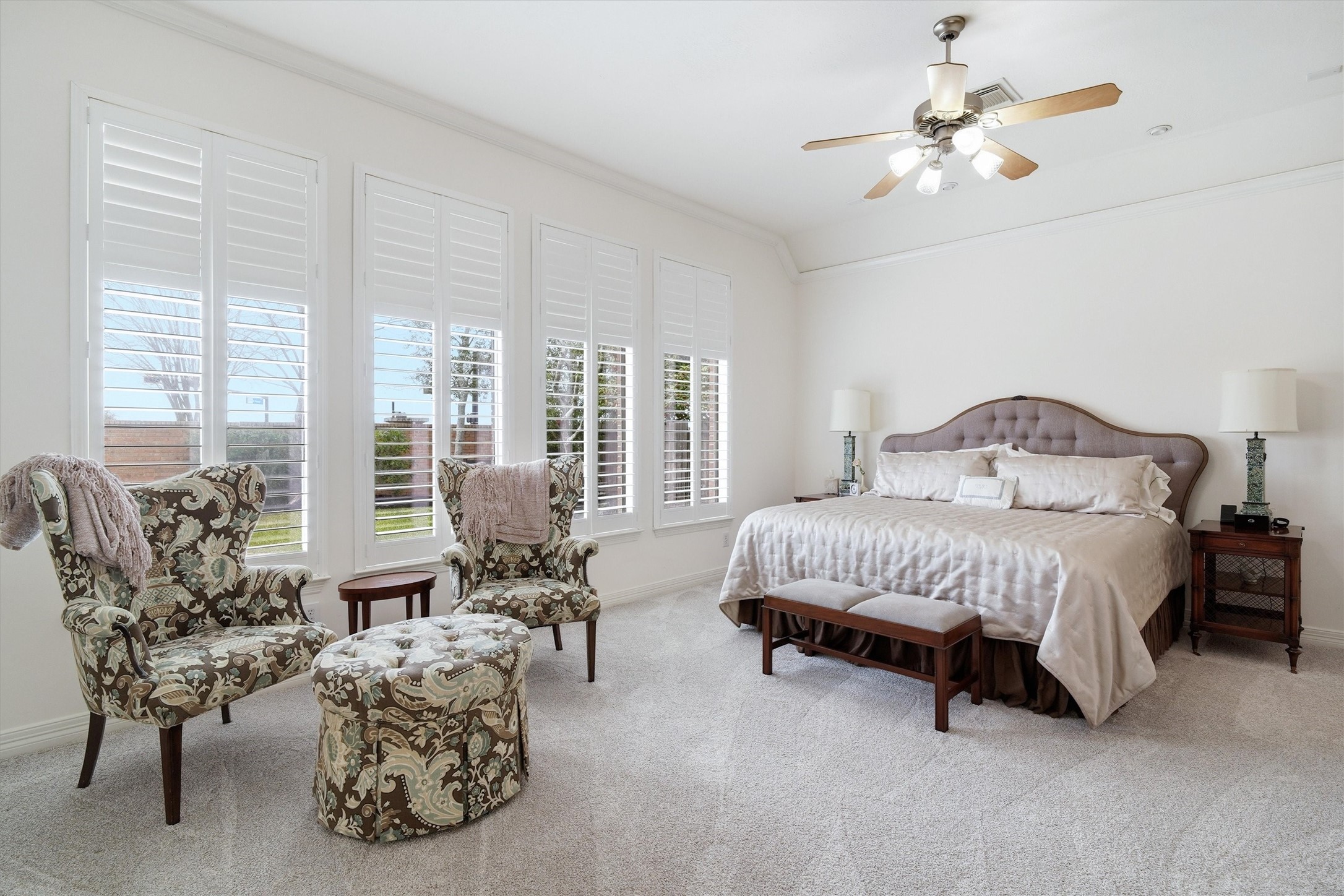 1558 Viejo Road League City, TX 77573 - Photo 10 of 28 Generous primary suite with high ceiling, plush carpet, and large windows offering backyard views.